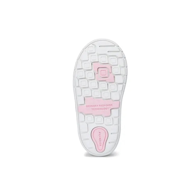 White sole of Stride Rite Kids' London Sneaker in Soft Pink leather upper