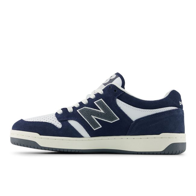 Medial profile of the New Balance 480 in navy leather with a perforated toe