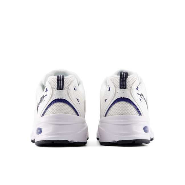 Rear heel view of the New Balance 530 pair in white with a navy ABZORB heel