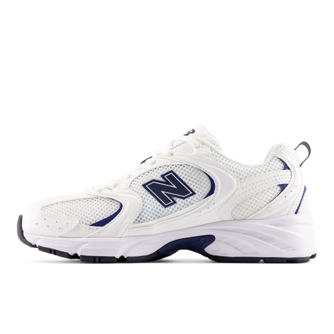 Medial profile of the New Balance 530 in white with navy overlays