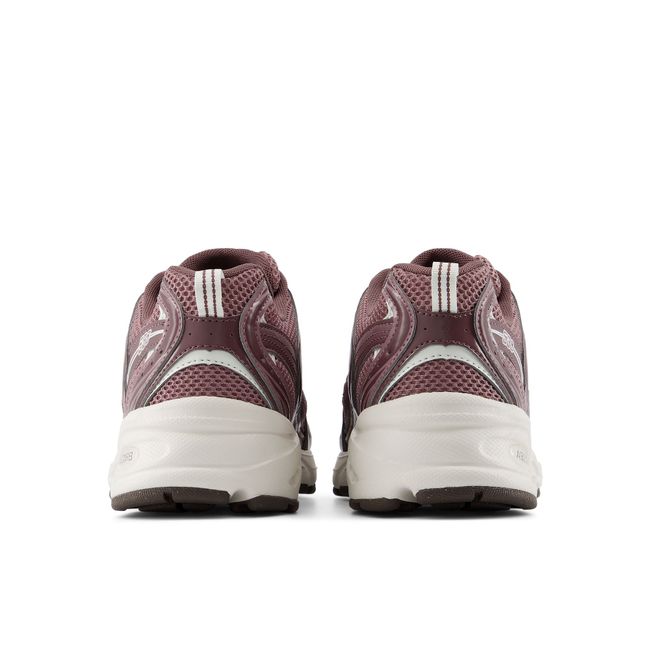 Rear heel view of the New Balance 530 pair in dusty mauve