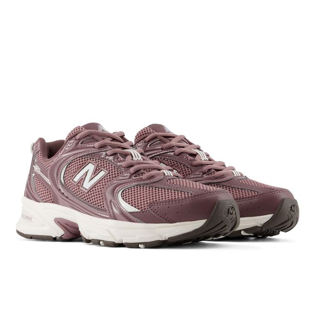 Pair of New Balance 530 retro sneakers in dusty mauve and white