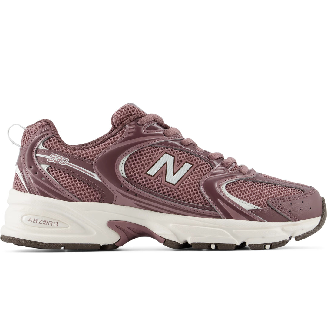 Side of New Balance Unisex 530 sneaker in Fast Track/Pebble