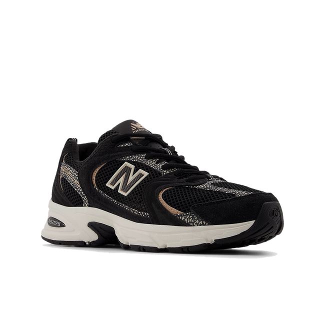 Front angled view of New Balance Unisex 530 Lifestyle Shoe in black and flat taupe
