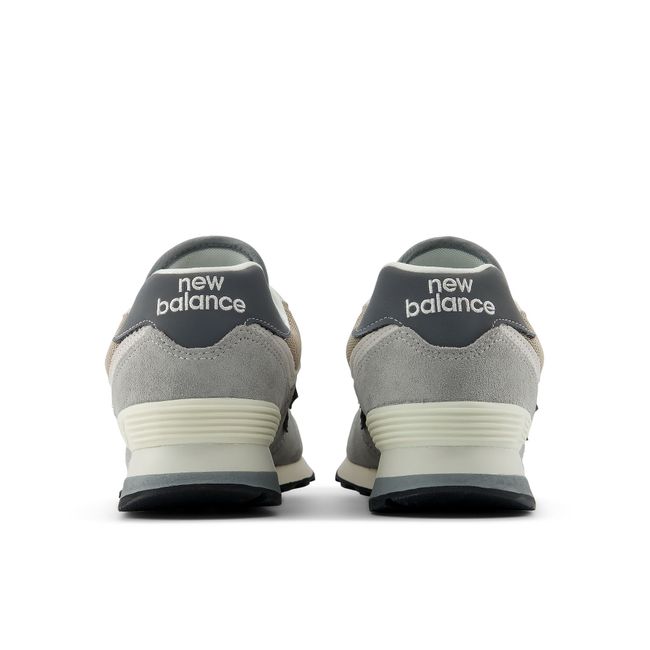 Rear heel view of the New Balance 574 pair in grey and stone