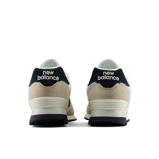 Rear heel view of the New Balance 574 pair in cream and navy