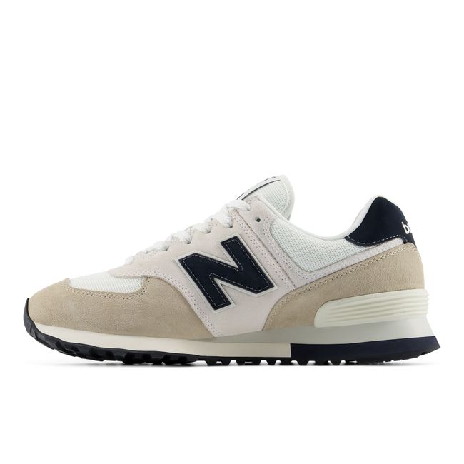 Medial profile of the New Balance 574 in cream suede and mesh