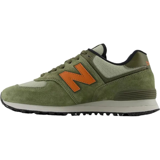 Medial side of Unisex New Balance 574 sneakers in olive green suede with orange accents.