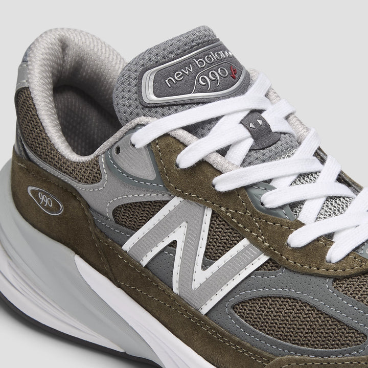 Close-up of New Balance Unisex 990v6 sneaker in Olive/Grey