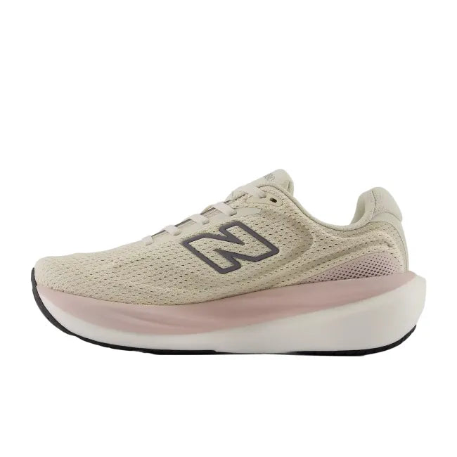 Medial side profile of New Balance 1080 V15 women's shoe in timberwolf tan showing Infinion midsole and perforated mesh upper