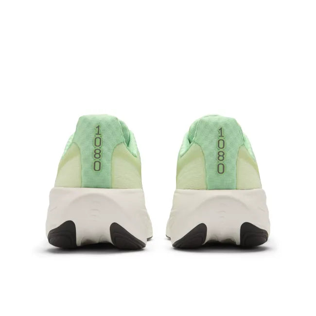 Heels of light green New Balance women's running shoe with white midsole.
