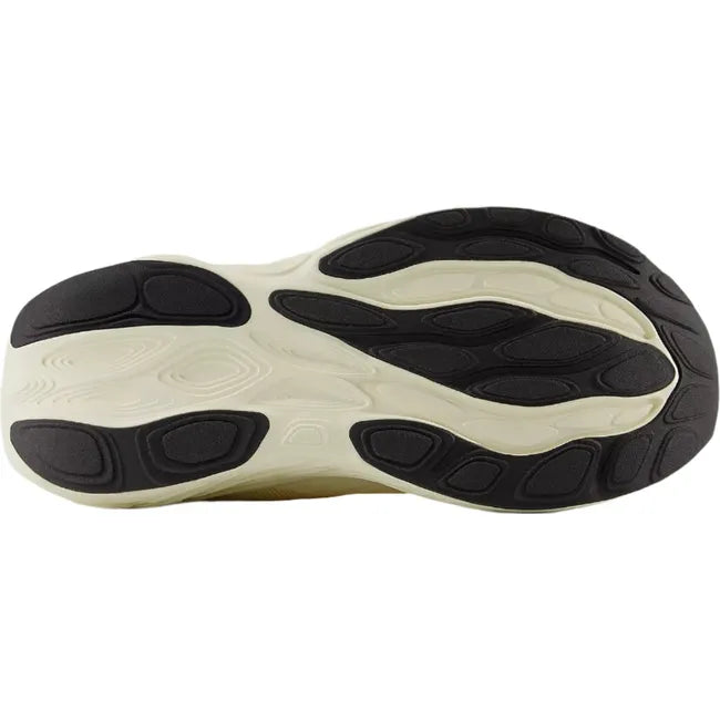 Sole of New Balance Women&#39;s Fresh Foam X 1080 V14 Running Shoe in yellow with black tread