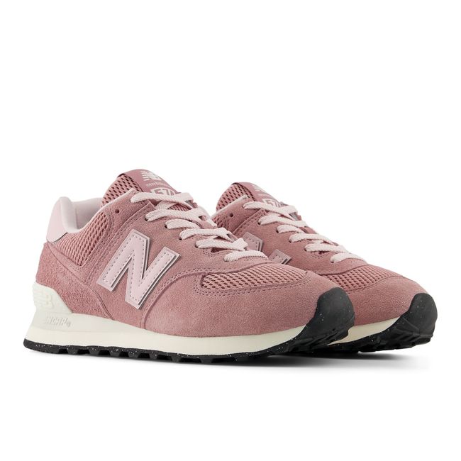 Pair of New Balance 574 sneakers in dusty rose with cream midsoles