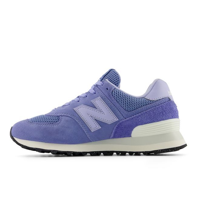 New Balance Women's 574 Lifestyle shoe in blue indigo and white, medial view.