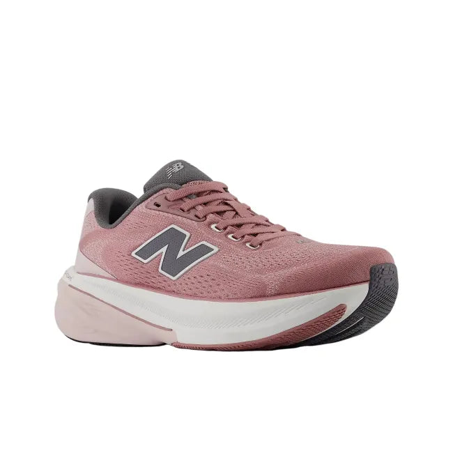 Side profile of New Balance 860 V15 women's stability running shoe in rosewood pink showing rocker profile and midsole