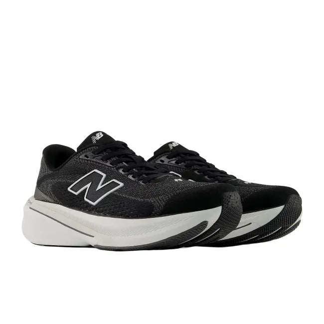 Medial view of New Balance Fresh Foam X 860 V15 in black and white showing synthetic mesh upper and Stability Plane
