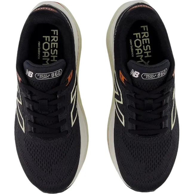 Top-down view of New Balance Fresh Foam X 860v14 sneakers in black with orange accents.