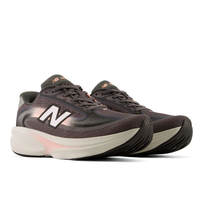 Pair of New Balance Ellipse running shoes in dark magnet grey and peach
