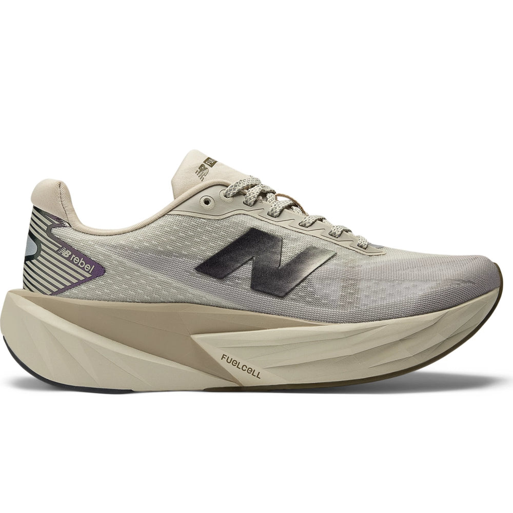 Side of New Balance Women's FuelCell Rebel v5 Running Shoe in Shipyard/Arid Stone/Woodland