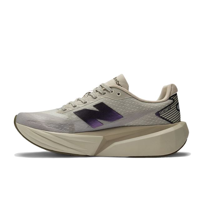 Medial side of New Balance Women's FuelCell Rebel V5 Running Shoe in Shipyard/Arid Stone/Woodland beige