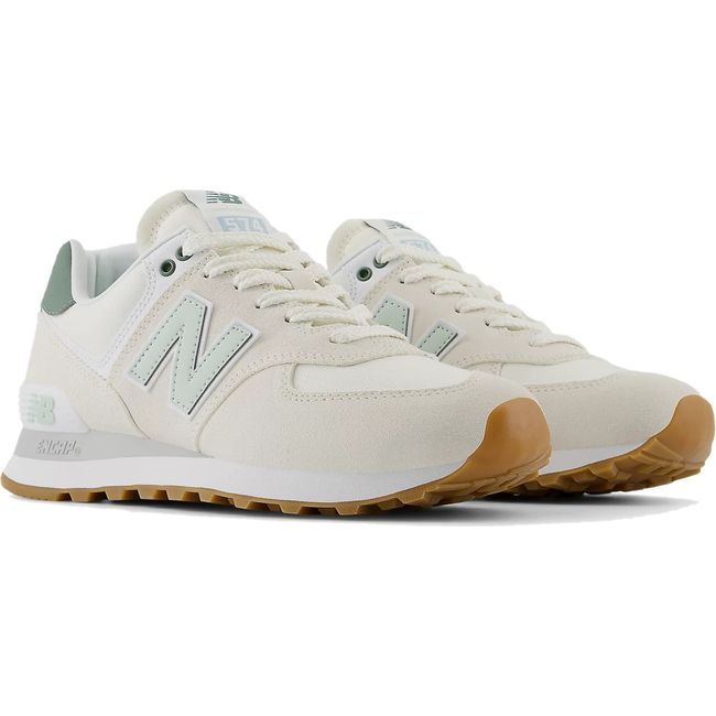 Pair of Women's New Balance 574 Lifestyle Shoes in Sea Salt beige and New Spruce green