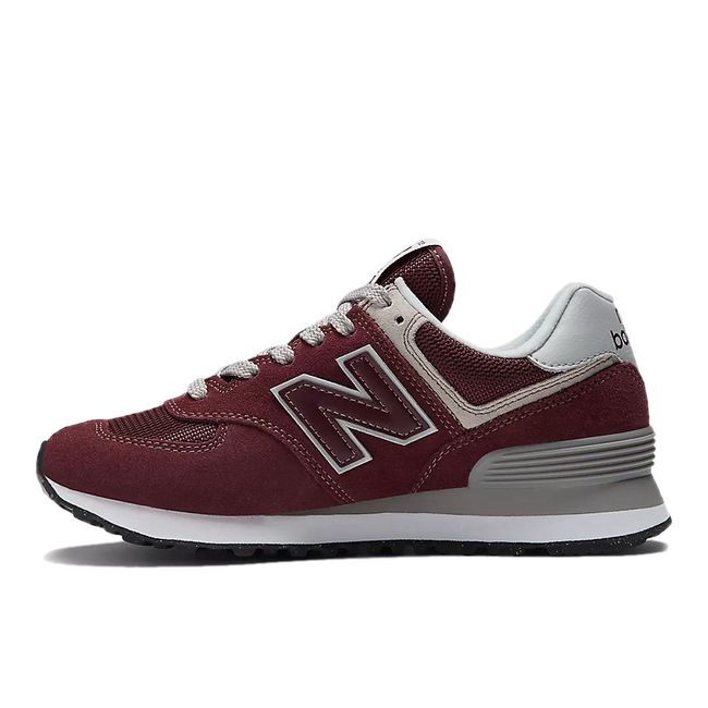 Medial side of Women's New Balance 574 Core Shoe in burgundy red suede and mesh