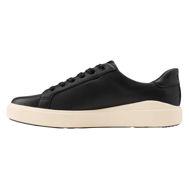 Medial side of Women’s Kizik Vegas 2 Sneaker in black with off-white sole and handsfree step in