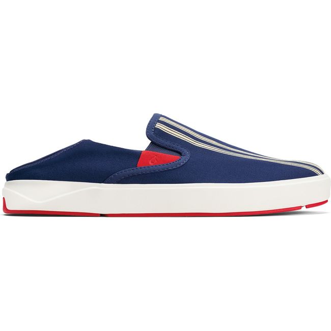 Lateral side of Men's Olukai Laeahi shoe in navy. White sole. Red accents. Slip on drop in Heel down