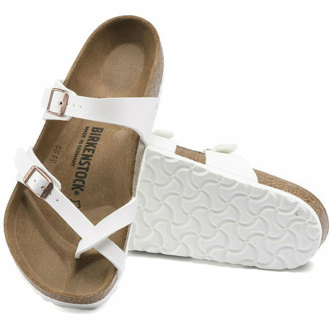 Pair of white Birkenstock Mayari sandals, one showing the sole, the other the upper.