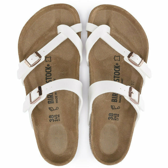 Top-down view of a pair of white leather Birkenstock Mayari sandals with copper adjustable buckles.