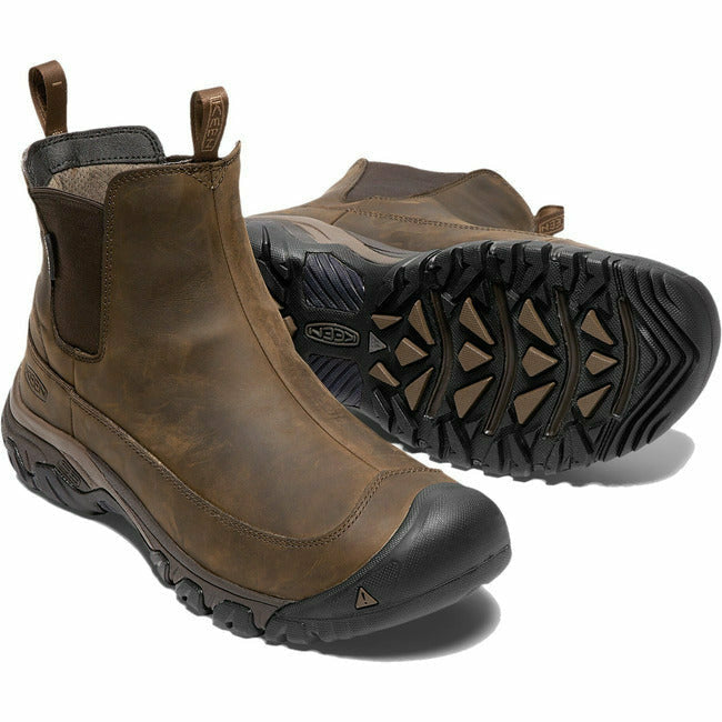 Pair of Men&#39;s Keen Anchorage III Boots in brown leather. One shows the sole and the other the upper