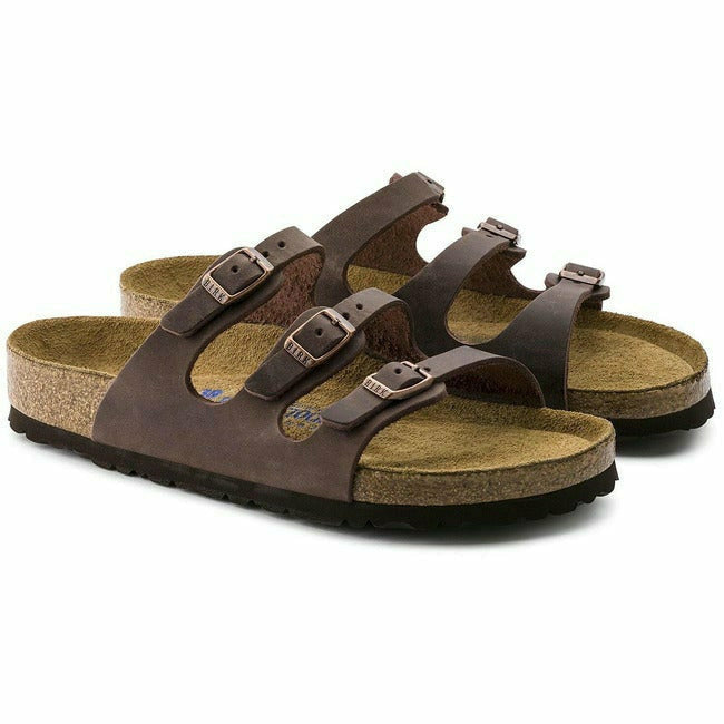 Pair of  brown Birkenstock Florida soft footbed sandal with three adjustabe straps and cork footbed