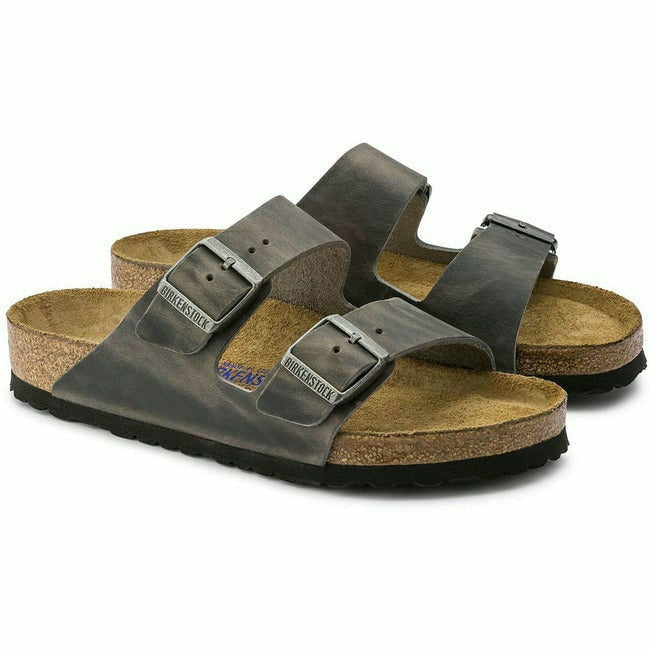 Pair of Grey Birkenstock Arizona Oiled Leather Soft Footbed Sandals with two straps and cork footbed