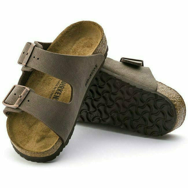 Mocha suede Birkenstock Kids&#39; Arizona sandals. One showing the sole, the other showing the upper. 