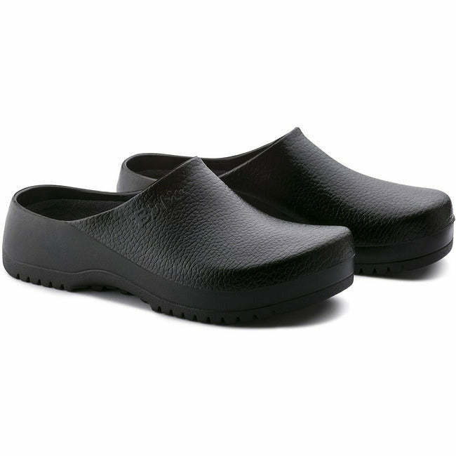 Slightly angled view of a pair of the Black Birkenstock Professional Super Birki clog for healthcare and utility, featuring a water-resistant and dirt-repellent polyurethane exterior and &#39;Birki&#39;s&#39; branding on the lateral side of the instep.