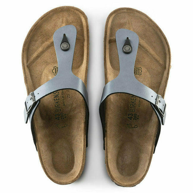 Top-down view of silver Birkenstock Gizeh sandals with a buckle and cork footbeds