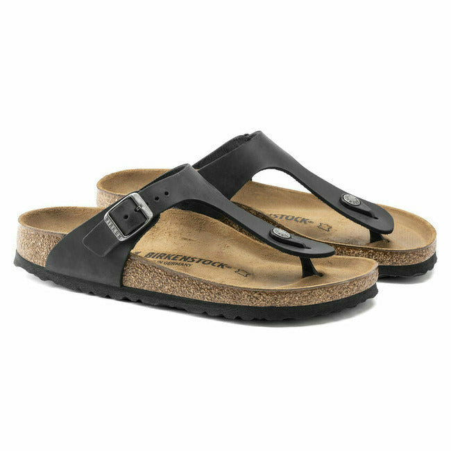 Pair of Black Birkenstock Gizeh oiled leather sandals with adjustable metal buckles and cork footbed