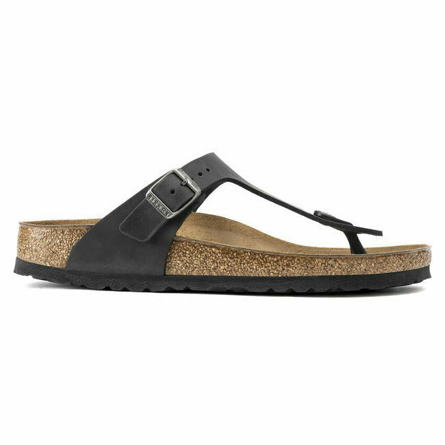 Side of Black Birkenstock Gizeh oiled leather sandal with adjustable metal buckle and cork footbed