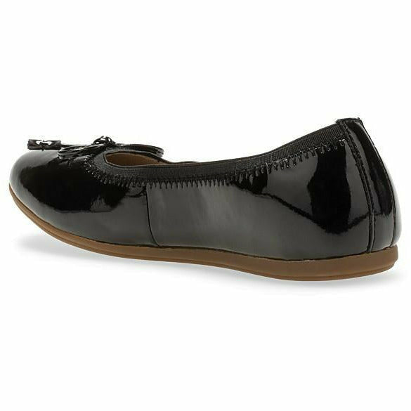 Medial angled view of Kids Hush Puppies Josie Flat in patent black with a bow tie