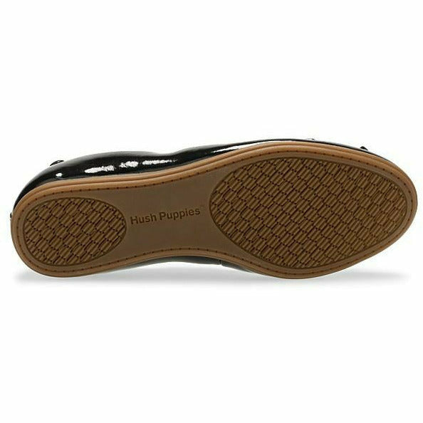 Sole of Kids Hush Puppies Josie Flat in patent black a brown outsole
