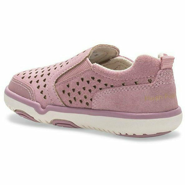 Medial angled view of Kids Hush Puppies Marley Sneaker in pink suede with velcro closure