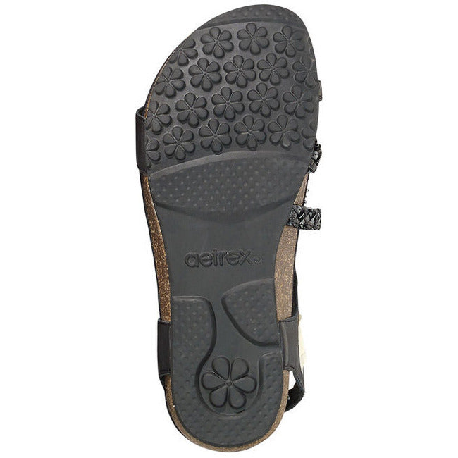 Sole of Aetrex Women&#39;s Jillian Braided Quarter Strap Sandal in black